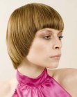 Clean short hairstyle with rounded corners that accentuates the face