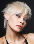 Short platinum blonde hair with styling for a bed head look