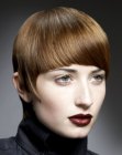 Short haircut with precise cutting lines and rounded bangs