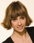 Classic bob haircut with ends that flip out and jagged bangs
