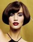 Short contoured bob with curved bangs and smooth styling