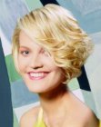 Short blonde hair with box layering and much volume