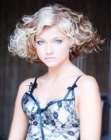 Short hair with a wedge silhouette, curls and volume