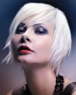 Short platinum blonde hair with textured layers along the nape