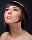 Haircut with a geometrical shape for shiny brown hair