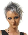 Short hairstyle with an asymmetrical shape and a metallic gray hue