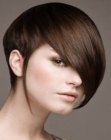 Short hairstyle with heavy bangs and an undercut