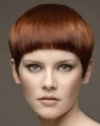 Very short hairstyle with half-moon shaped bangs