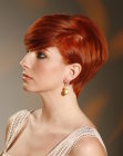 Pixie cut with a long nape section and side bangs