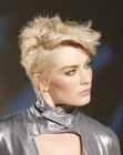 Blond pixie haircut with choppy texture and spikes