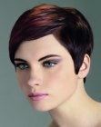 Pixie cut with different shades of brown and side bangs