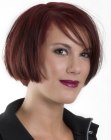 Chin-length bob with angled bangs for auburn hair