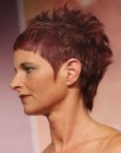 Extravagant short haircut with very pointed sideburns