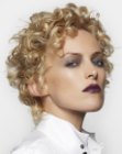 Short blonde hair with layering and curls