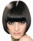 A-line bob with razor texturing and sharp just above the eyes bangs