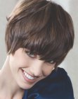 Short Inès de la Fressange bob with forward swept hair