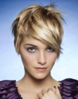 Short cropped feminine hairstyle with warm blonde shades