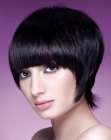 Short hairstyle with a wispy strand that enhances the neckline