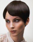 Smooth pixie hairstyle with a side parting