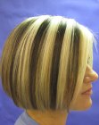 Bob haircut with dual coloring that rides up in the back
