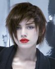 Trendy short haircut with razored lines and longer sections