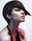 Blunt short haircut with long tapered bangs