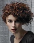 Short curly hair styled to one side of the head
