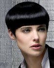 Glossy short hair with bangs and pointy sideburns