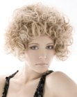 Short blonde hairstyle with spiral curls