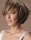 Contoured bob with razor-cutting and scalp-lift for volume