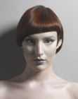 Short asymmetrical haircut with one side styled behind the ear