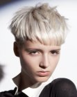 Rebellious short hairstyle with the hair clipper cut high over the ears
