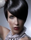 Short haircut with tapered sides and long curved bangs