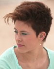 Very short haircut with a tapered neck section for women