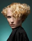 Sophisticated short hairstyle with blonde curls and wves
