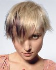 Short asymmetrical haircut for blonde hair with a splash of violet