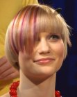 Short blonde hair with a purple color stripe