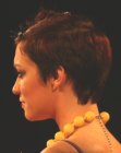Pixie haircut with a cut out ear and volume