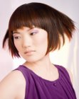 Trendy short bob featuring bangs with cut-outs
