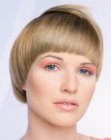 Short hair with a round cutting line and bangs that curve above the eyebrows