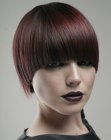 Slick short helmet shape hairstyle for mahogany hair