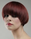 1980s inspired angled bob with heavy bangs