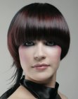 Short blunt cut hair with magenta red colors