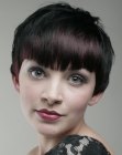 Modern short hairdo with styling towards the face