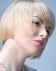 Short blonde bob that softens the face