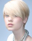 Short blonde crop with long bangs and a side part