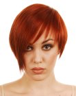 Wearable asymmetrical haircut with a bright copper hair color