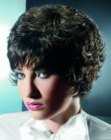 Short layered hair with bangs and small dense curls