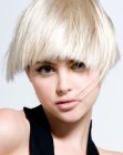 Short blonde hair with jagged cutting lines