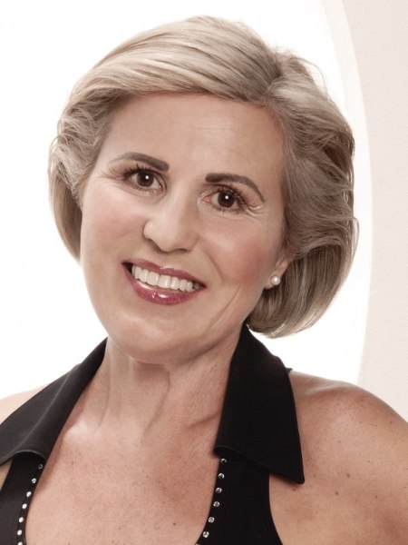 Out of the face hairstyle for older women, with the hair styled back